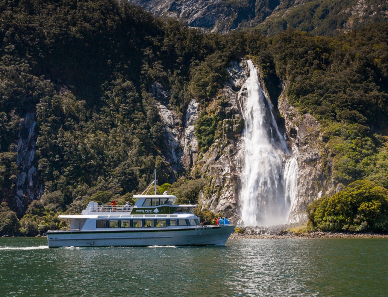 Mitre Peak Cruise at Milford Sound. Waterfall in the background.