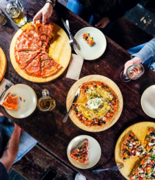 A overhead shot of people dining at Winnies Gourmet Pizza Bar
