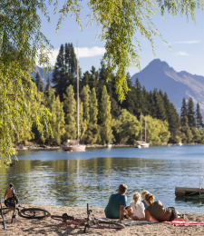 A family enjoying the summer sunshine at Queenstown lakefront