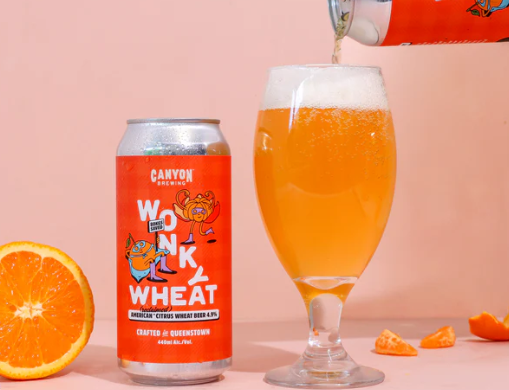 a can of Canyon Brewing's new brew, Wonky Wheat and a glass of it being poured.