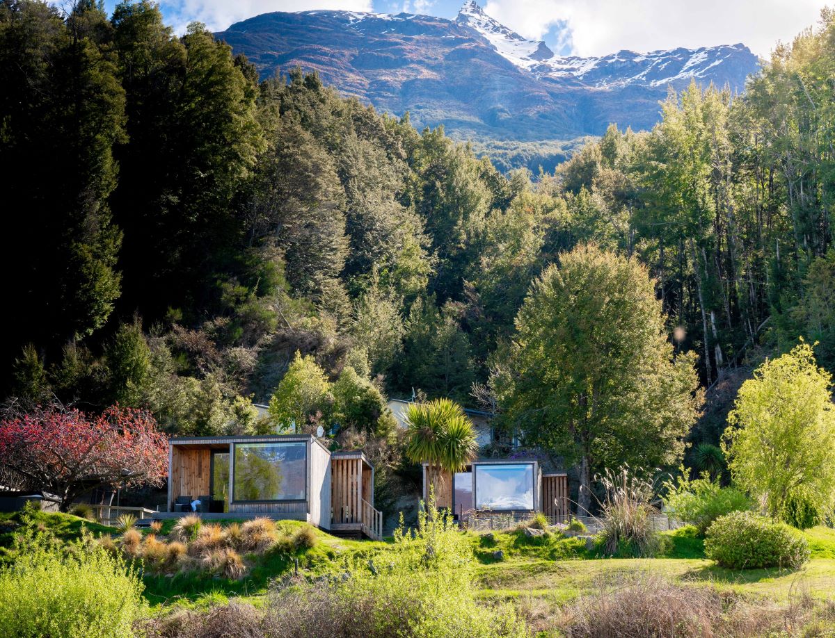 Kinloch Wilderness Retreat with navite bush and mountains in the background.